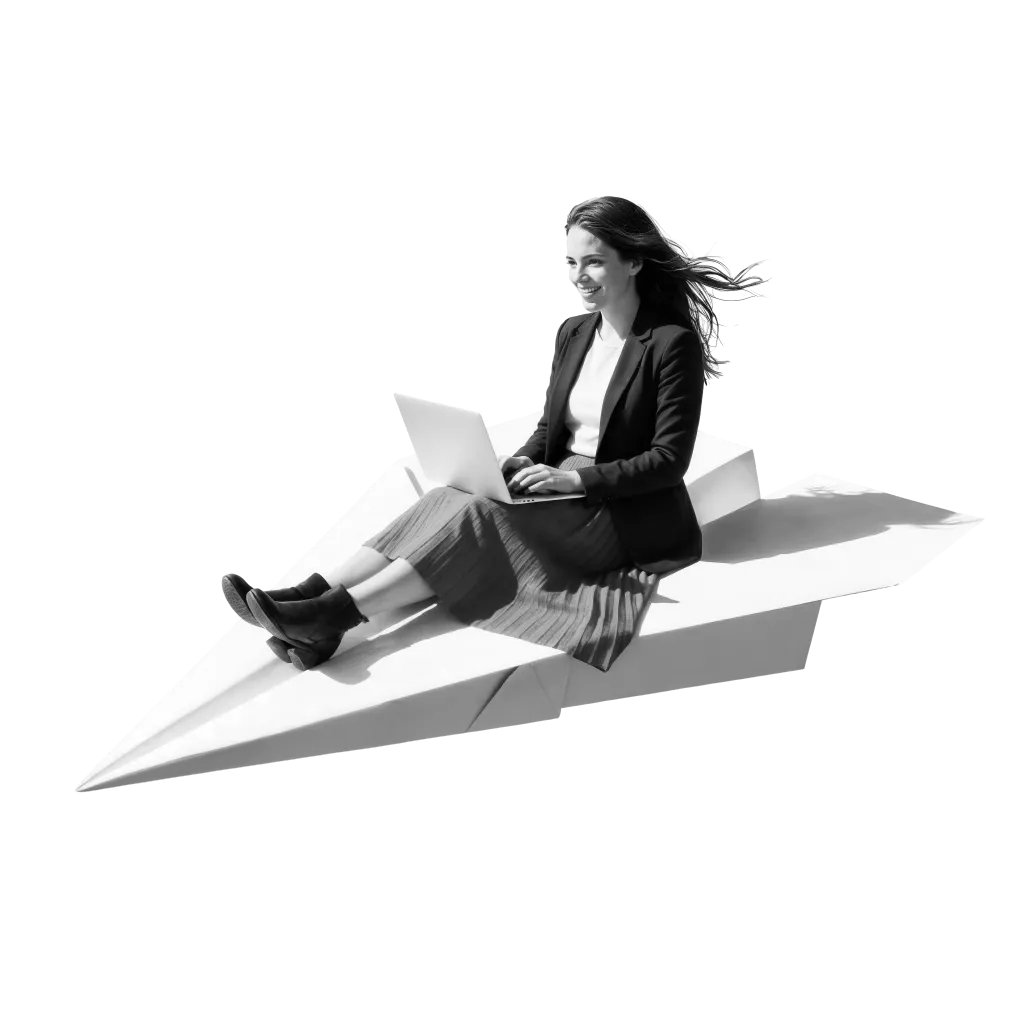 A salesperson working on a laptop while riding a paper airplane